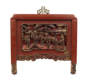 A Chinese panel showing monks and a temple, red lacquered and gilded carved timber, 19th/20th century, 33 x34cm