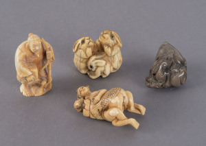 Four Japanese netsuke, carved ivory and stone, including erotic scene, rabbit group, lizard and old man, 19th and 20th century, the largest 5cm high