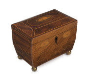 A George III Sheraton tea caddy, flame mahogany with satinwood string inlay with marquetry cartouches, all resting on brass bun feet, late 18th century, 17cm high, 20cm wide, 13cm deep PROVENANCE: Blair Castle, Scotland