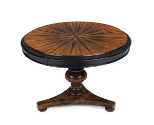 An apprentice cabinet maker's tilt-top miniature supper table, impressively inlaid starburst top, turned column tri-form base on bun feet, circa 1835, 16cm high, 24cm diameter