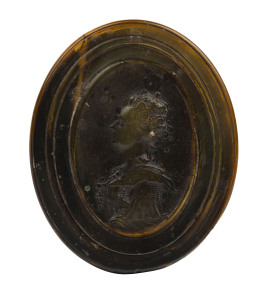 JOHN OBRISSET pressed horn oval box with portrait of Queen Anne, early 18th century, 3cm high, 8cm wide, 10cm deep PROVENANCE: Christie's, The Duchess of Westminster Eaton Hall, Sept. 21st, 2004.