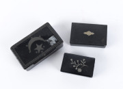 Three snuff boxes, black papier-m&acirc;ch&eacute; with inlaid silver, English and Ottoman Empire, 18th century, the largest 8.5cm wide