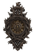 A Black Forest wall clock, time and strike movement in carved timber case, late 19th century, ​50cm high