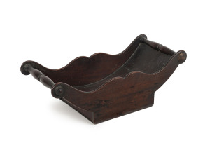 A Georgian mahogany cheese wheel holder, circa 1800, 14.5cm high, 43cm wide, 20cm deep