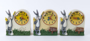 Three "Bugs Bunny Talking Alarm" clocks, battery powered, made in Hong Kong and Taiwan, circa 1970, 18cm high