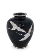 A Japanese cloisonne vase with flying cranes on black ground, early to mid 20th century, ​9cm high