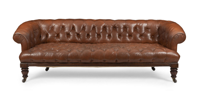 Chesterfield antique brown leather settee with turned walnut legs and porcelain casters, late 19th century, 220cm across the arms