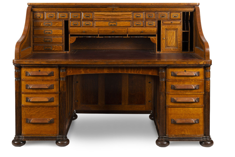 CUTLER American roll top desk, finely crafted in panelled oak, late 19th century, named on the escutcheon and with Buffalo mark inside the drawer, 130cm high, 181cm wide, 97cm deep