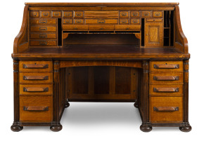 CUTLER American roll top desk, finely crafted in panelled oak, late 19th century, named on the escutcheon and with Buffalo mark inside the drawer, 130cm high, 181cm wide, 97cm deep