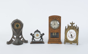 A French alarm clock in ornate brass case, a German timber cased clock, and two metal cased American clocks, ​19th and 20th century, (4 items), the largest 22cm high