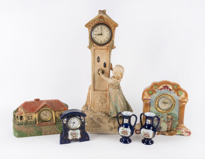 A figural chalk ware clock, an architectural form clock, two porcelain cased clocks, one with porcelain vase garniture, 19th and early 20th century, (6 items), the largest 53cm high