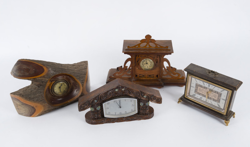 Four assorted table clocks including, mulga wood case, carved Maori case, fretwork case and one with Roman numerals, 20th century, ​the largest 24cm high