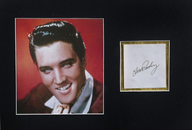 ELVIS PRESLEY: mounted display featuring image of a smiling Elvis (20x19cm) with signature alongside on plain piece; CofA label adhered to reverse; framed & glazed, overall 52x41cm.