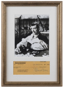 CLARK GABLE: mounted display featuring iconic Gone with the Wind image of Gable as Rhett Butler playing cards, beneath is Gable's signature on a 1949 First National Bank of Los Angeles cheque, CofA affixed to reverse; framed & glazed, overall 47x30cm. - 2