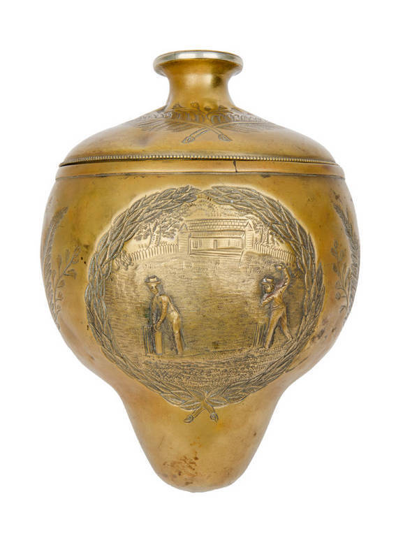 CRICKET TROPHY, brass trophy with attractive cricket scene, crossed ferns, and engraved "South Melbourne, Challenge Cup, Presented By, Thomas Smith Esq., 1883-4". Missing base & figure on top, nevertheless early tophy with attractive cricket scene.