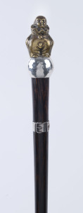 An Art Deco walking stick, rosewood shaft with sterling silver belt collar and bronze Pierrot handle, ​86cm high