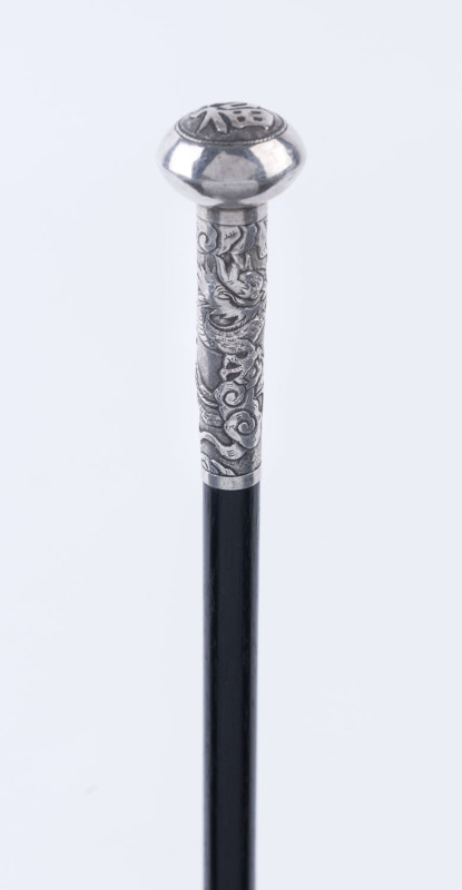 A Chinese walking stick, ebony shaft with Chinese silver dragon handle, character mark to top, 19th century, ​82cm high