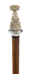 A walking stick with oak shaft, sterling silver collar and carved Asian ivory figural handle, 19th century, 89cm high