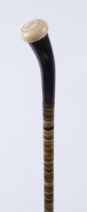 An English walking stick with polished horn segment shaft and ivory handle, 19th century, 89cm high