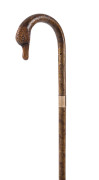 An English walking stick, full silver birch with 9ct rose gold collar, 1908 inscription and finely carved duck head handle with inset glass eyes, 19th century, 97cm high