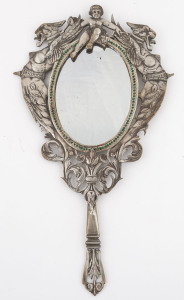 A French handle mirror, silvered bronze with green rhinestones, adorned with cherub and griffins, circa 1830, rare, ​34cm high