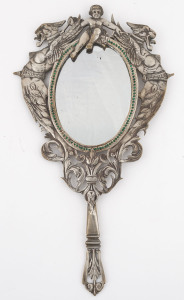 A French handle mirror, silvered bronze with green rhinestones, adorned with cherub and griffins, circa 1830, rare, 34cm high
