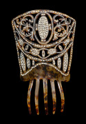 An Art Deco mantilla style cocktail hair comb, faux tortoiseshell celluloid adorned with diamant&eacute;s, circa 1925, 22cm high