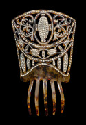 An Art Deco mantilla style cocktail hair comb, faux tortoiseshell celluloid adorned with diamantés, circa 1925, 22cm high