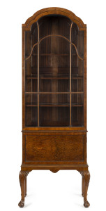 An antique English walnut display cabinet in the Chippendale style, circa 1890s, with makers plaque "Jas. Shoolbred & Co. Ltd. Tottenham Court Rd. London W.1." 184cm high, 63cm wide, 35cm deep