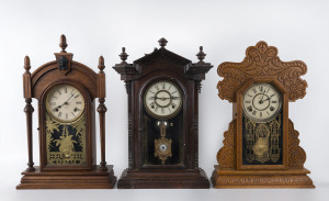 Three American cottage clocks in timber cases by Welch, Ingrahams and Ansonia, late 19th century, ​the largest 59cm high