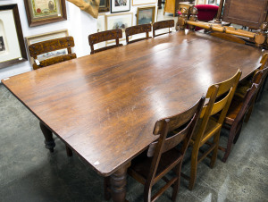 A farmhouse kitchen table, Australian cedar, circa 1870s, top not original but nice, 72cm high, 233cm wide, 120cm deep The table was constructed from timbers recycled from the counters of the Oriental Bank; the actual bank building became the "Euroa Bank" for the Ned Kelly film starring Mick Jagger in 1970!
