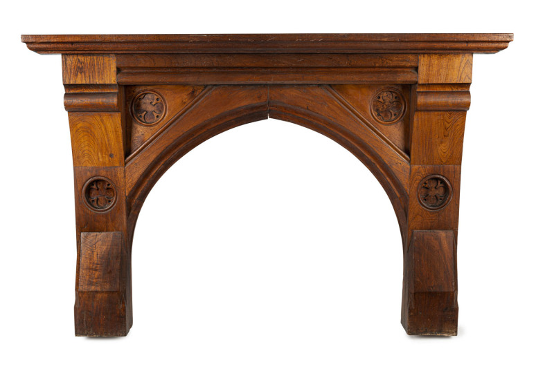 An impressive Colonial Pugin gothic fire surround made from thick slabs of cedar inset with huon pine carved panel, Tasmanian origin, circa 1840s, ​130cm high, 191cm wide, 28.5cm deep