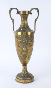 A Continental brass urn with repoussé cherry decoration, circa 1900, signed near base (illegible), ​48.5cm high