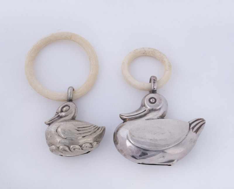 Two baby rattles, one sterling silver the other German silver plate by WMF, circa 1920, ​9cm and 9.5cm high