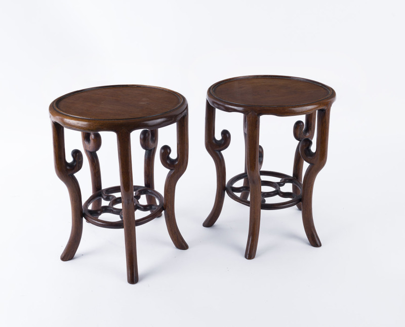 A pair of Chinese carved hardwood stands, 19th/20th century, ​30cm high, 25cm diameter