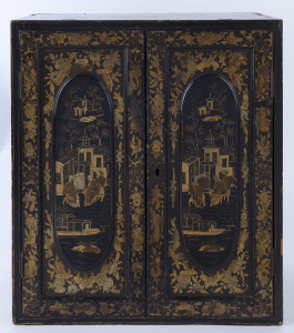 A Japanese miniature travelling chest of drawers with cabinet doors, Meiji Period, 19th century, 46cm high, 39cm wide, 21cm deep