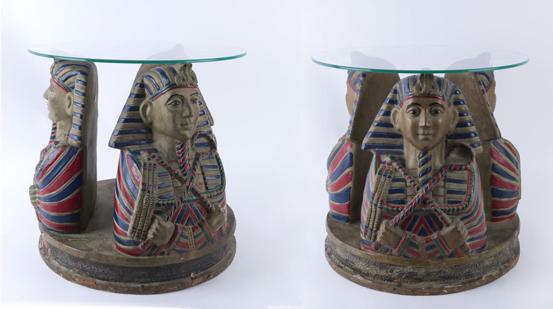 A pair of Egyptian style coffee tables, fibreglass with glass tops, 20th century, 48cm high, 48cm diameter