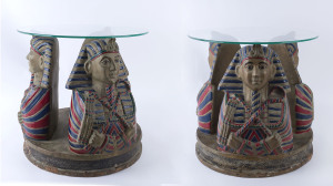 A pair of Egyptian style coffee tables, fibreglass with glass tops, 20th century, 48cm high, 48cm diameter