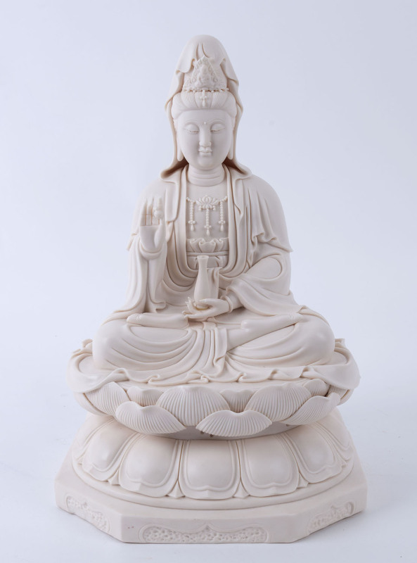 A Chinese seated Guan Yin Blanc De Chine porcelain statue, late 20th century, seal mark to back, ​38cm high