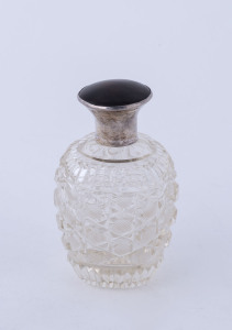 An English scent bottle, hobnail cut crystal with sterling silver and tortoiseshell top, by A. Wilcox of Birmingham, circa 1906, still has the original stopper, 8.5cm high
