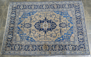 A Persian patterned blue and grey rug, early 20th century, 198 x 138cm