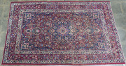 A hand-woven Persian rug on red background, circa 1930s, ​211 x 132cm