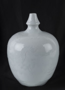 A Chinese blanc de Chine porcelain vase with phoenix and dragon motif, 20th century, ​23cm high