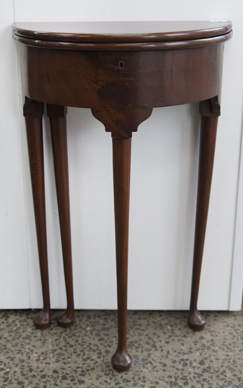 A Queen Anne style mahogany fold-over table, 19th century, 77cm high, 45cm wide, 22cm deep