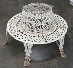 An English cast iron circular garden seat, 19th century, 88cm high, 115cm diameter