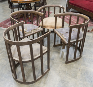 A Set of four oak barrel chairs in the manner of Josef Hoffmann (Wiener Werkstätte), late 19th century, retailed by W.H. ROCKE & Co. Melbourne. 56cm across the arms