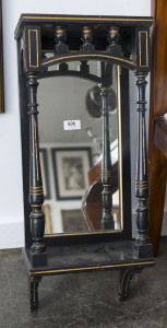 An English mirrored wall bracket, ebonised and gilded finish, circa 1885, ​64cm high, 27cm wide, 17cm deep