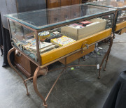 A custom-built jewellery display cabinet, wrought iron and glass with DC monogram (The Diamond Company, Melbourne), late 20th century, 110cm high, 160cm wide, 58cm deep