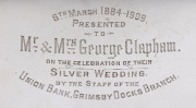 An English Art Nouveau sterling silver bowl with presentation inscription "6th March 1884-1909, To Mr. & Mrs George Clapham On The Celebration Of Their Silver Wedding, By The Staff Of The Union Bank, Grimsby Docks Branch", made in Birmingham, circa 1908, - 2