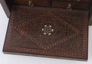 An Anglo-Indian spice box, padouk and sandalwood sumptuously inlaid with brass, bone, silver and ebony, interior fitted with seven staggered drawers, with original key, late 18th early 19th century, 13cm high, 19cm wide, 13cm deep - 3
